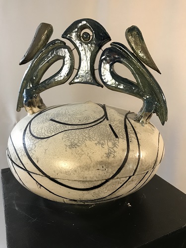 'Kisbah container a l’Africane,' Wheel thrown and raku fired with white crackle and copper glazes.  Tape resist design and nichrome wire inserts.  10 inches diam. x. 13 inches ht., by Joel Moses